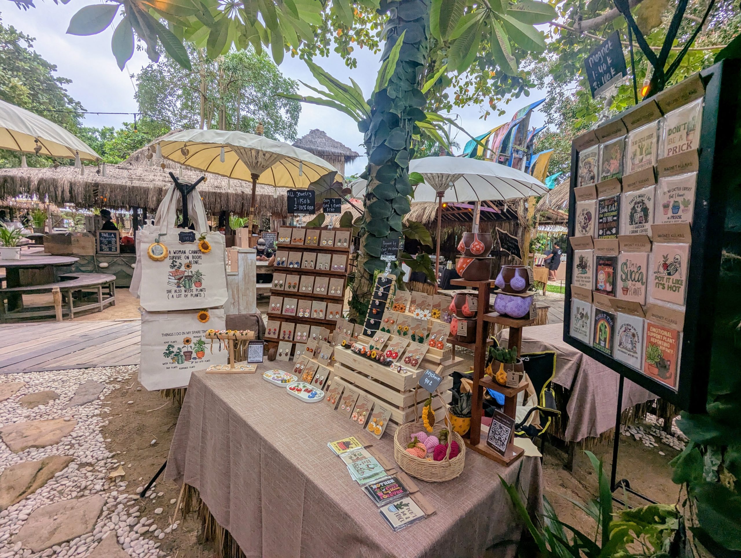 The Terra Flora Bali stall at La Brisa Sunday Market in Canggu with handmade earrings, tote bags and hand-painted pots